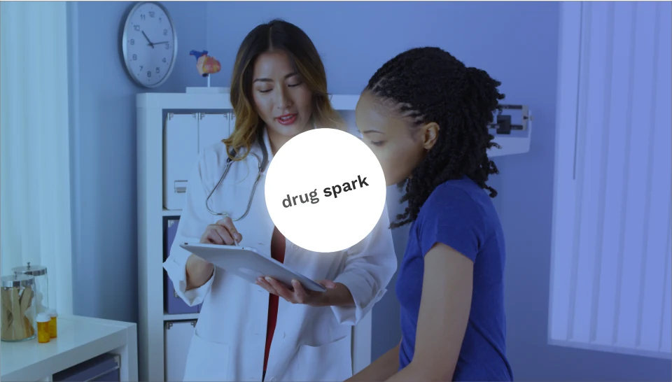 A clinician and patient with a drug spark badge