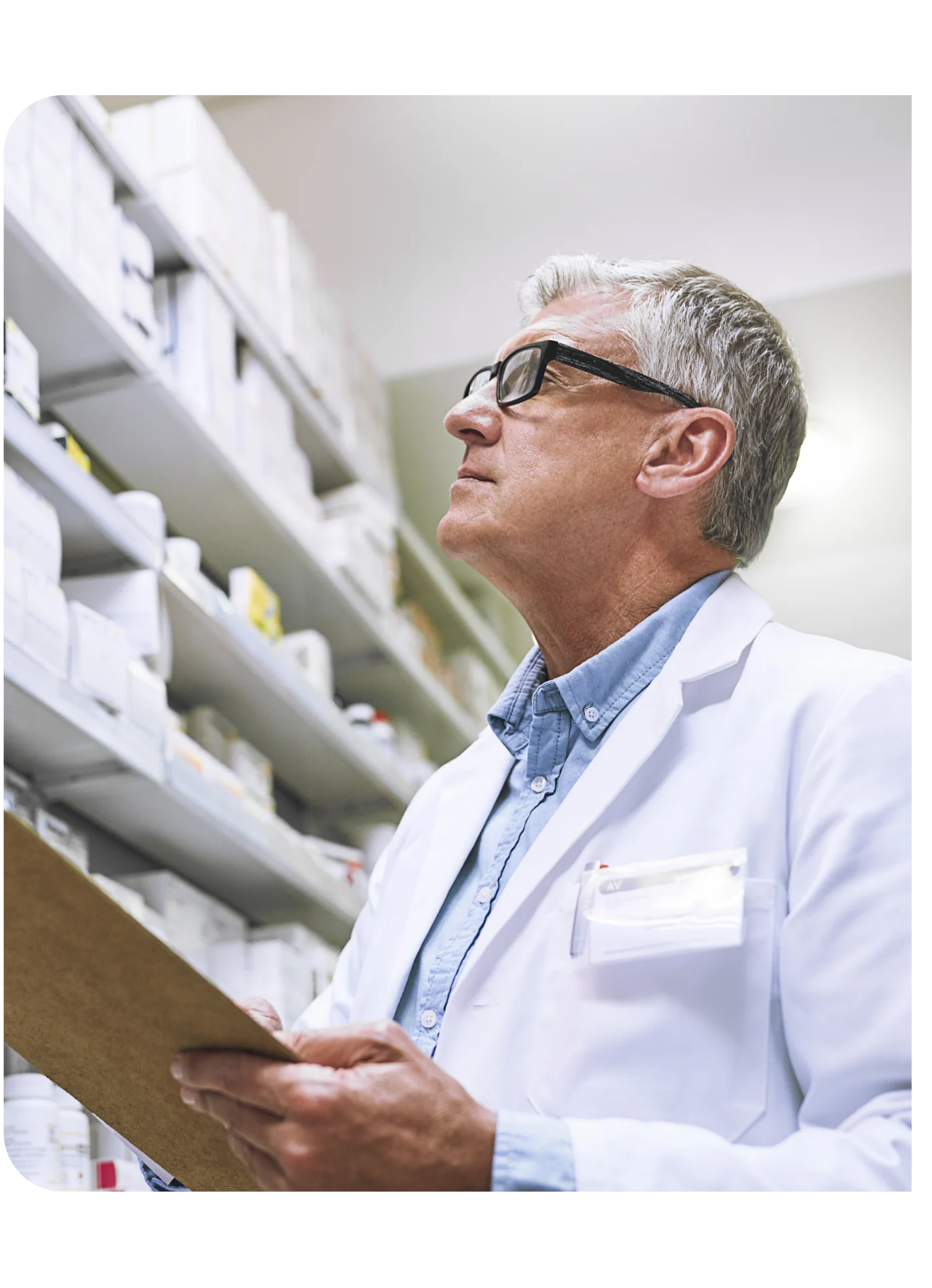 A pharmacist checking stock on the shelves